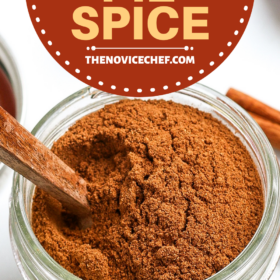 Apple pie spice in a mason jar with a wooden spoon.