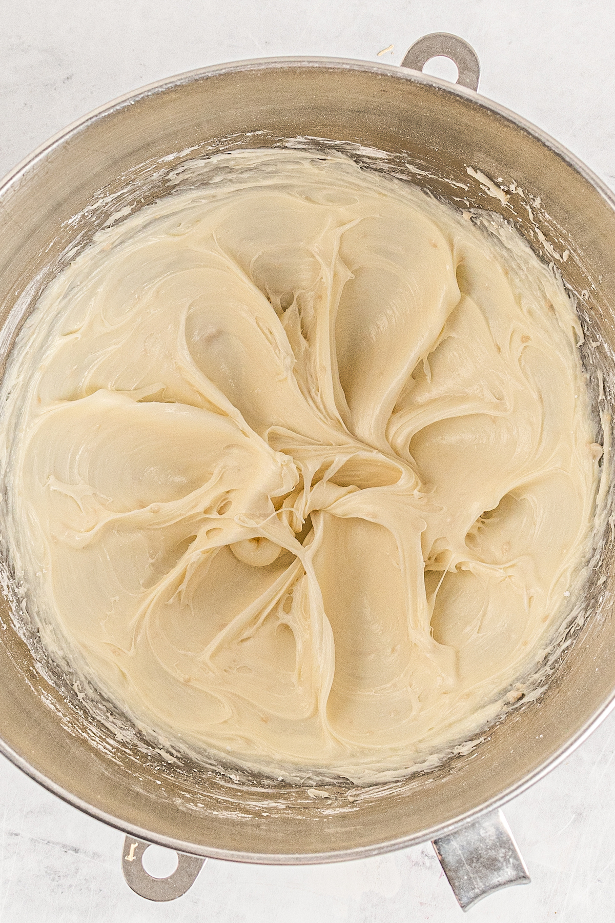 Cream cheese that's been whipped in a mixing bowl