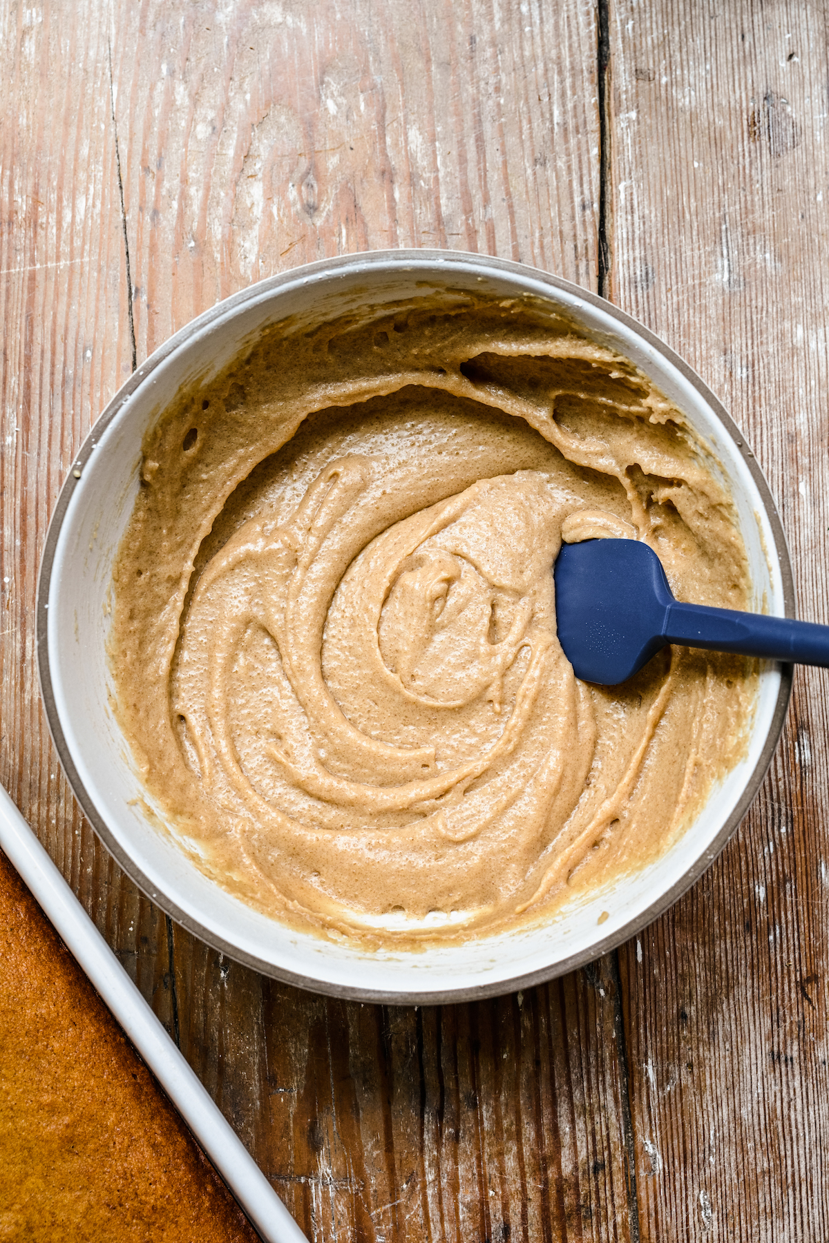 Creamy, light-brown frosting in a bowl.