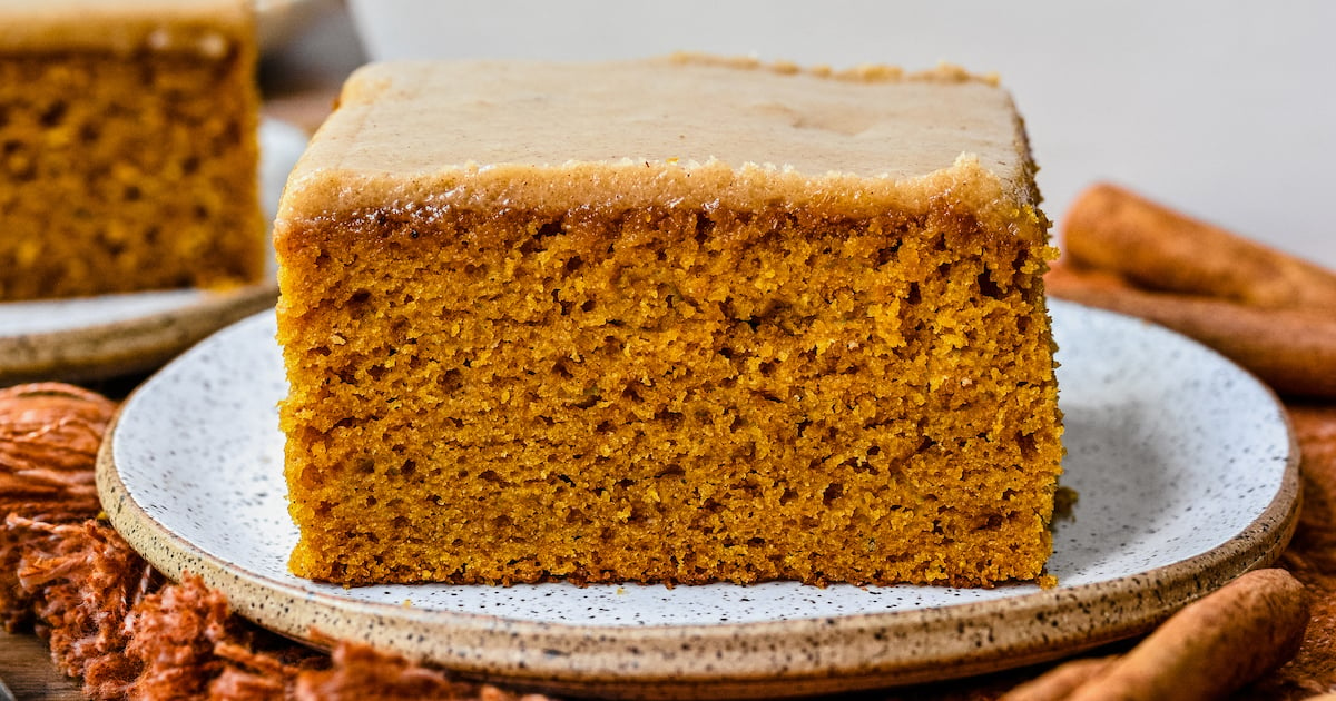 Close-up shot of pumpkin cake with brown sugar frosting, showing the delicate crumb.