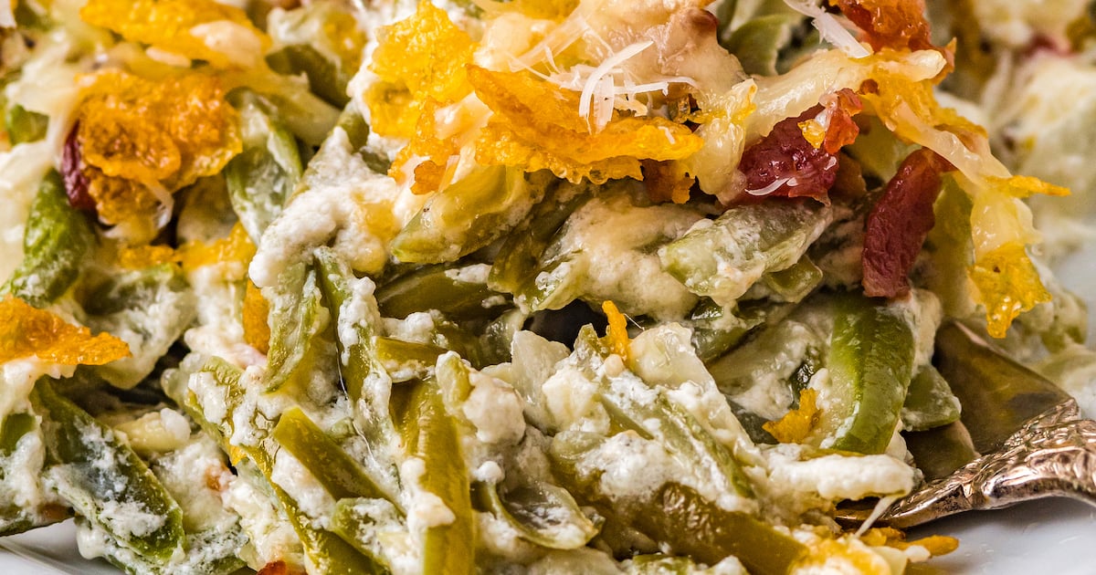 Creamed green beans topped with cheese, bacon, and cornflakes.