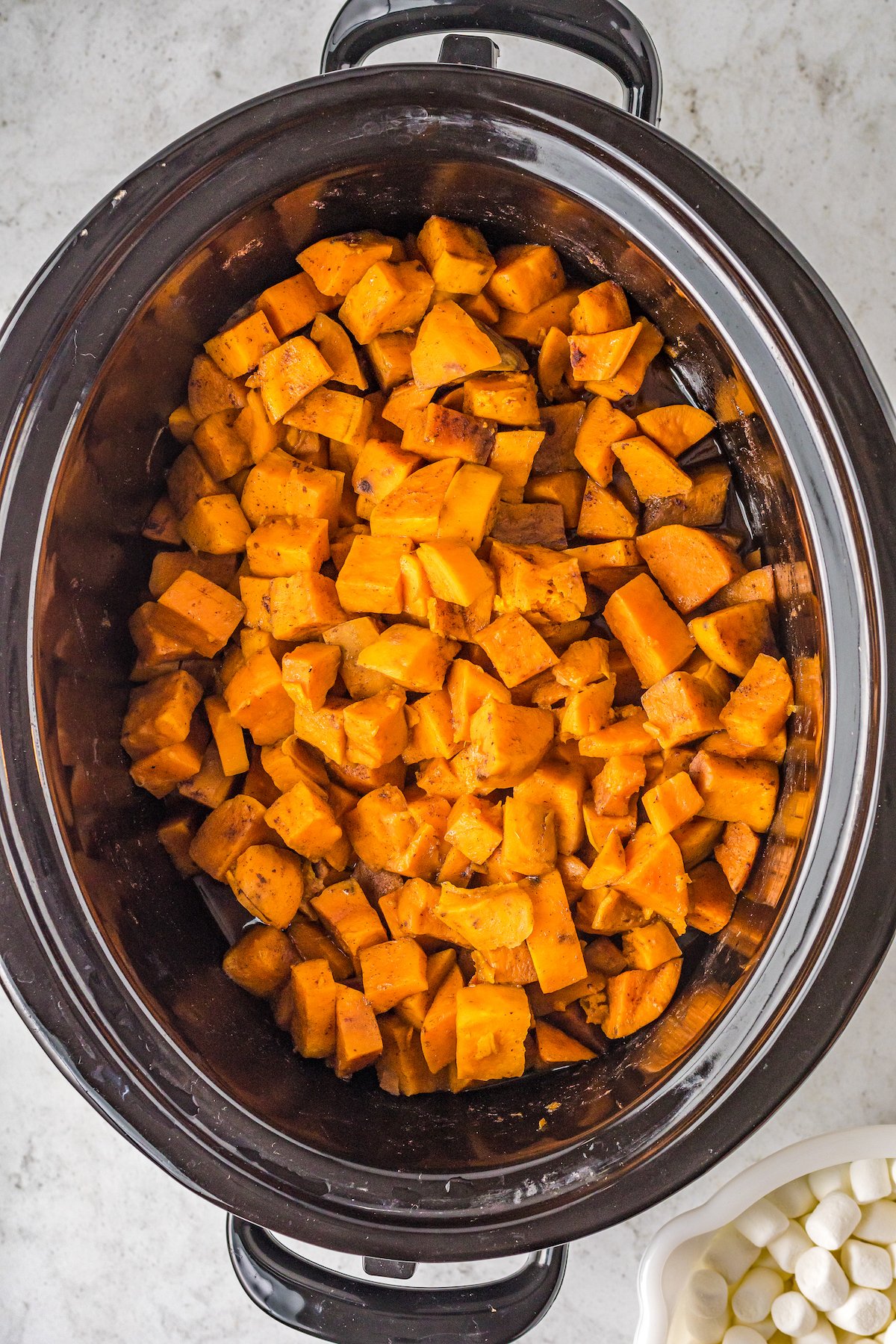 Cooked sweet potatoes in a crockpot.