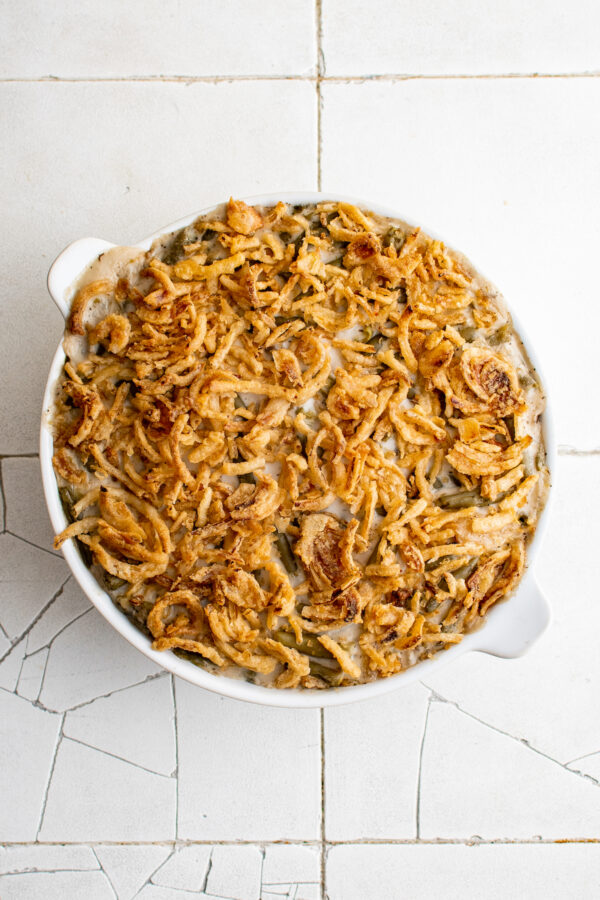 Baked easy green bean casserole with golden-brown fried onions on top.