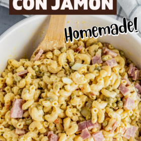 A big white bowl filled with puerto rican pasta salad with ham.