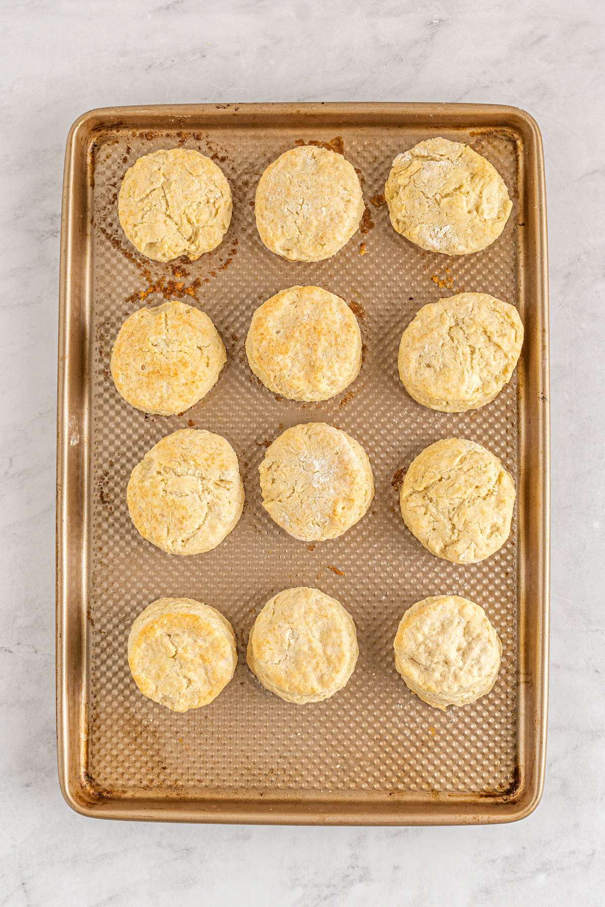 Baked biscuits on a baking sheet.
