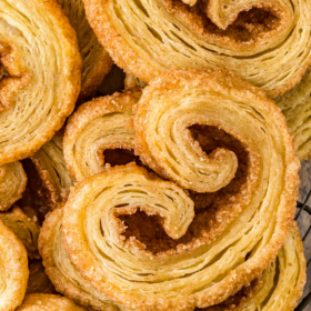 Palmier cookies stacked on top of each other.