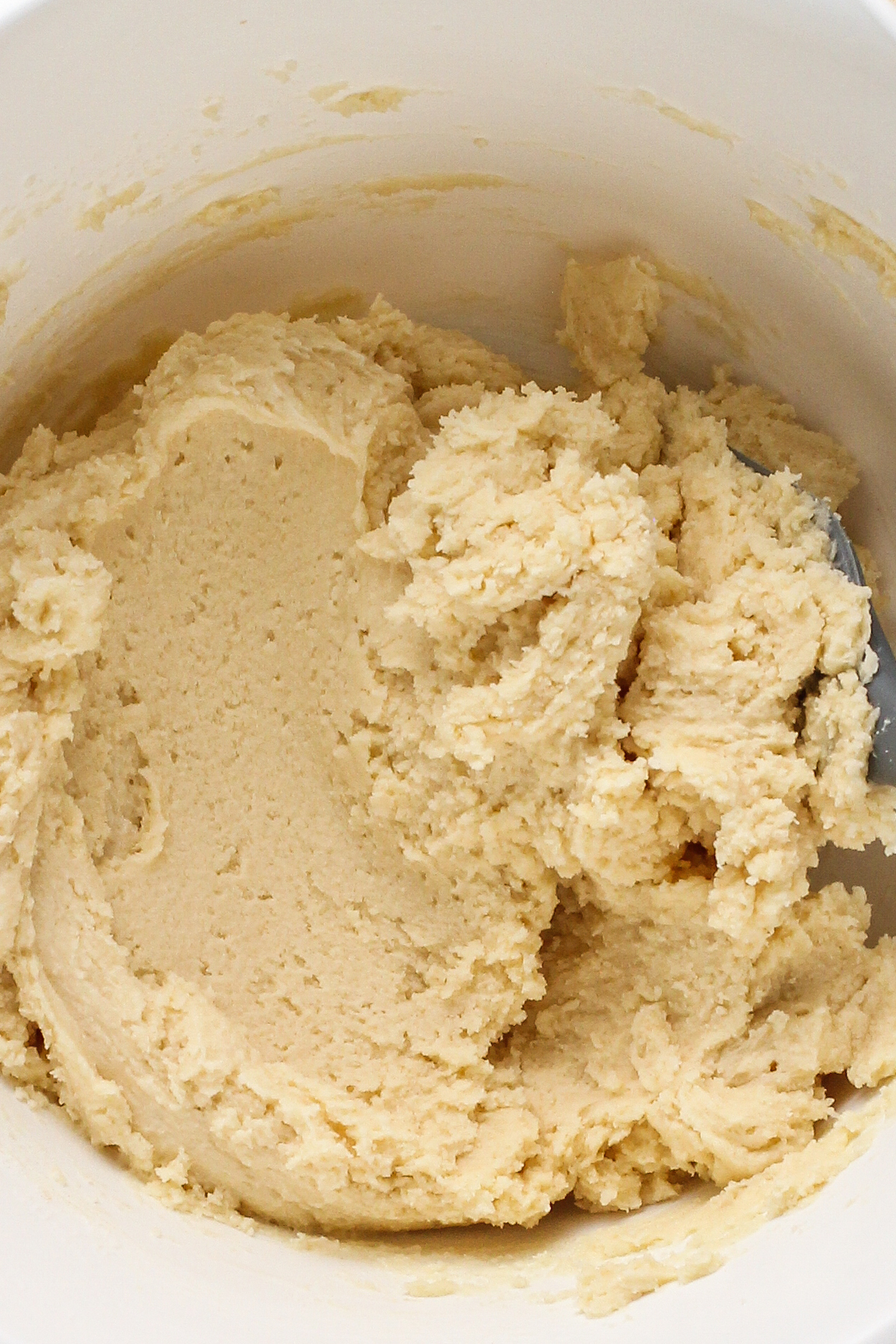 Sugar cookie dough in a mixing bowl.