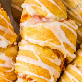 Pumpkin pie crescent rolls stacked on top of each other.