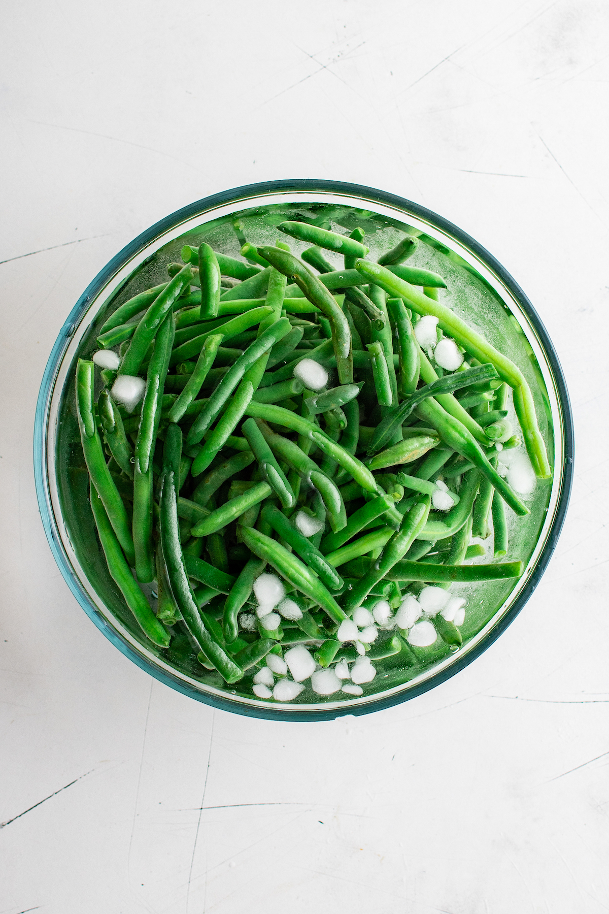 Green beans in an ice bath.