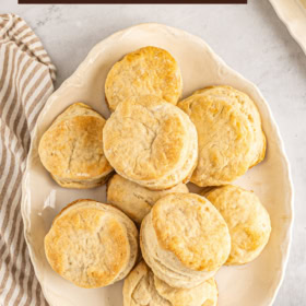 A platter of biscuits made with seven up stacked on top of each other.