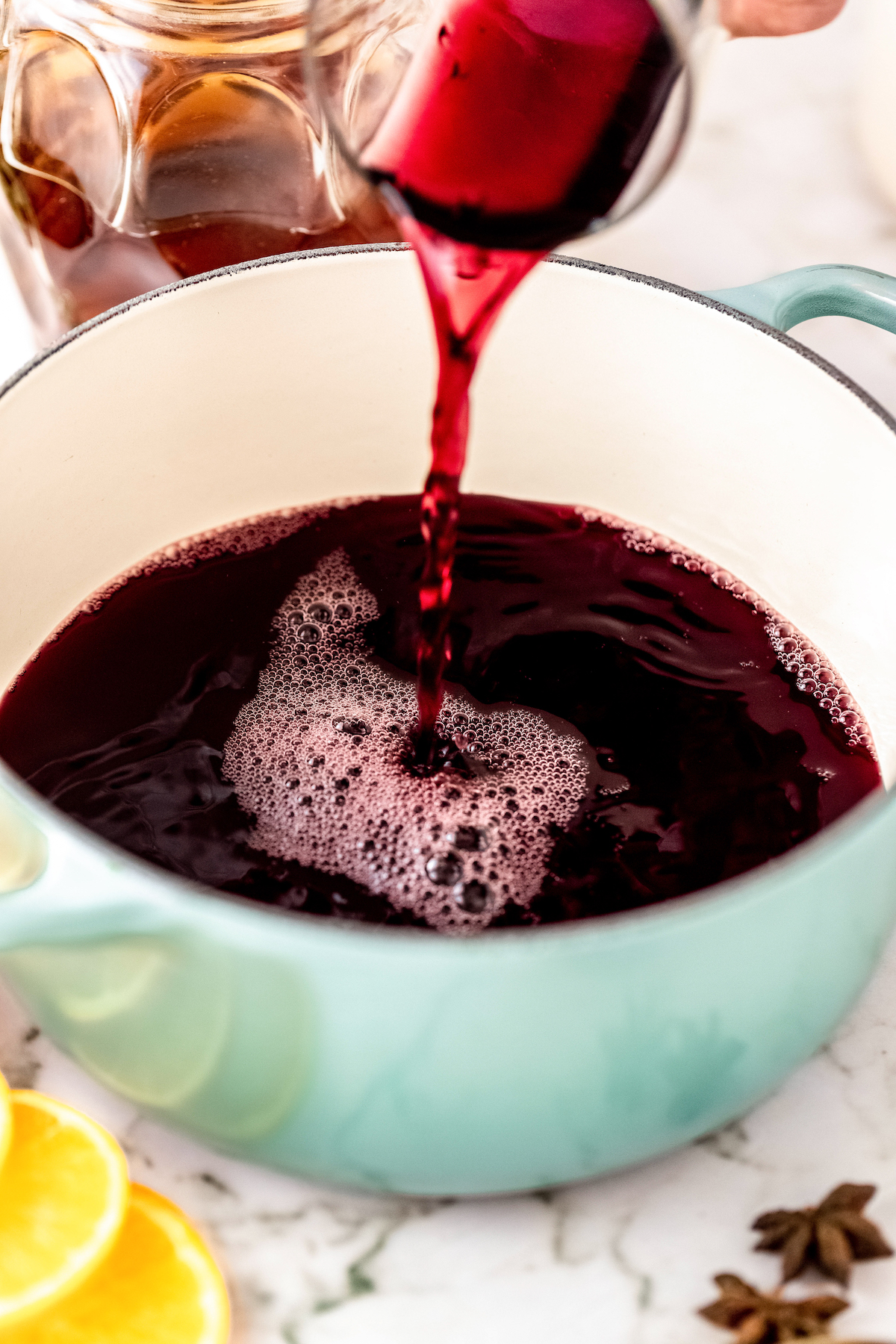 Pouring the wine into a pot.