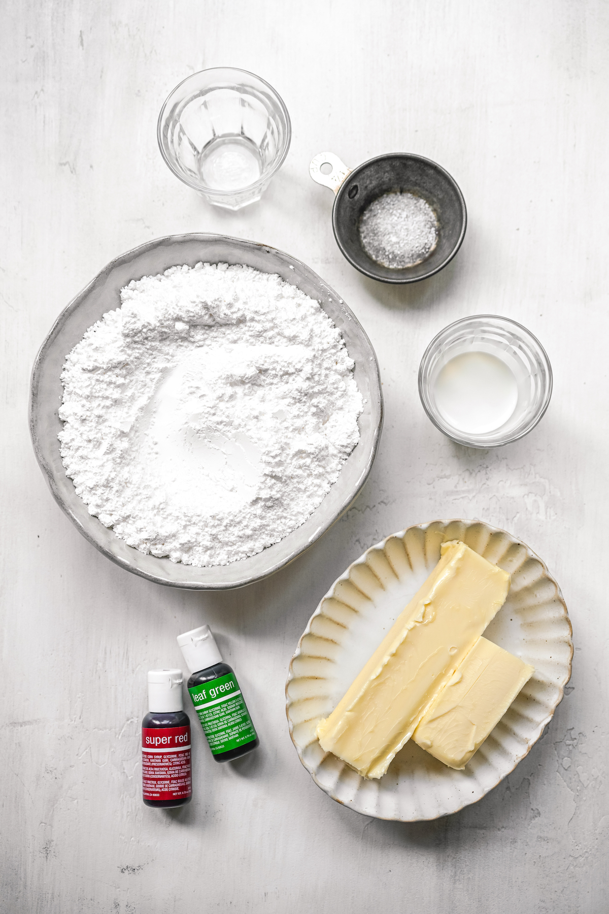 From top: Peppermint extract, salt, half and half, butter, food coloring, and powdered sugar.