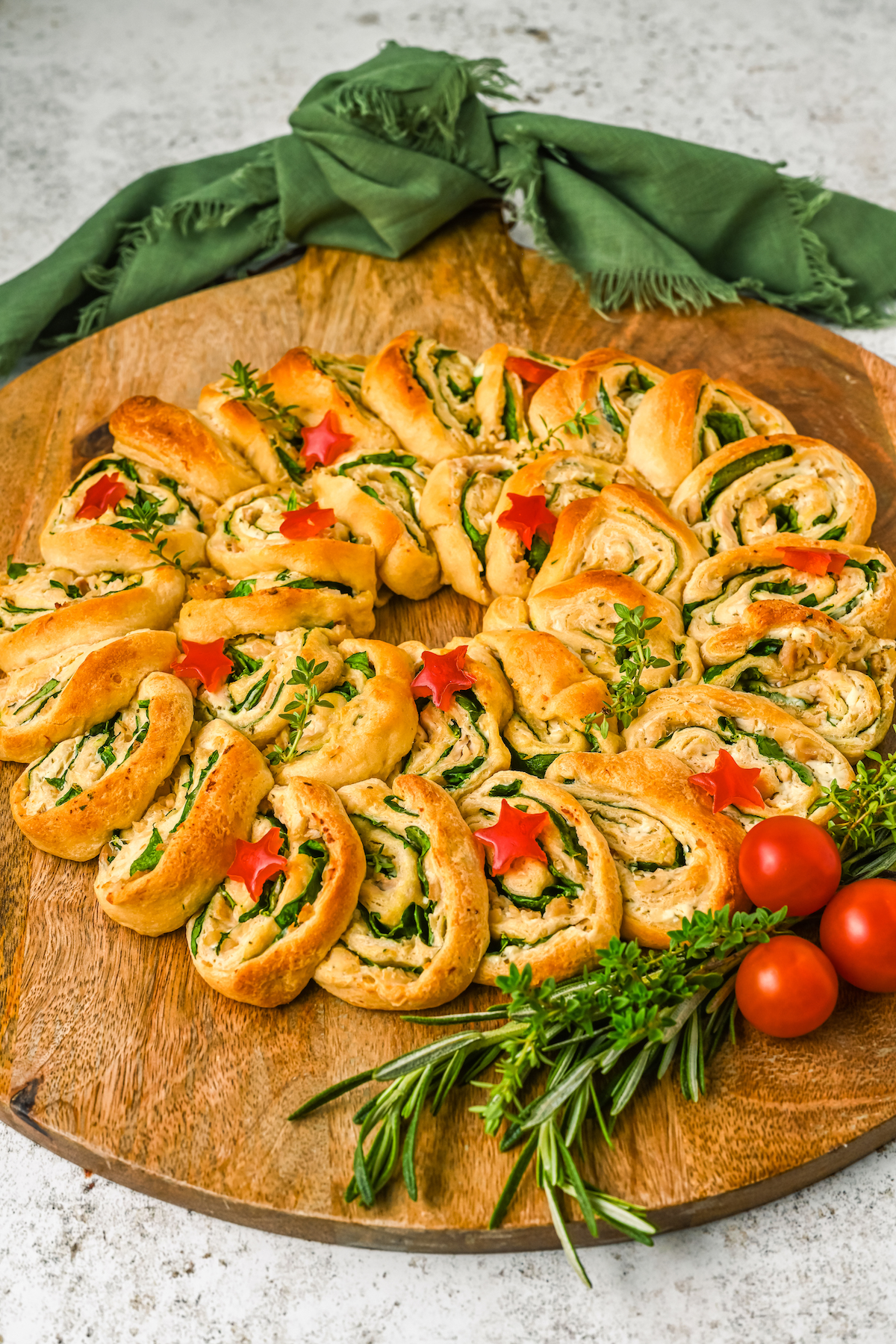 A holiday appetizer made of crescent dough and fillings, shaped like a wreath.