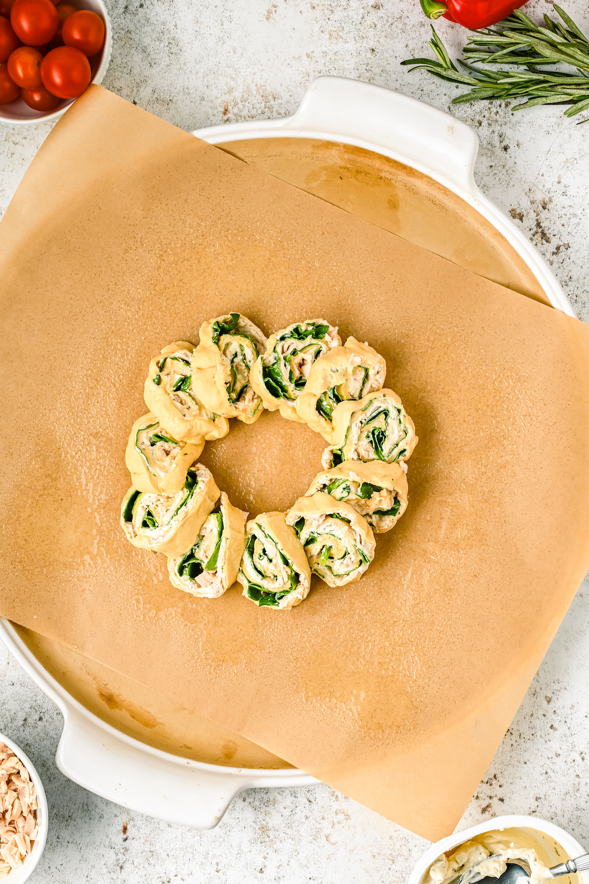 Crescent pinwheels with spinach and chicken arranged in a circle.