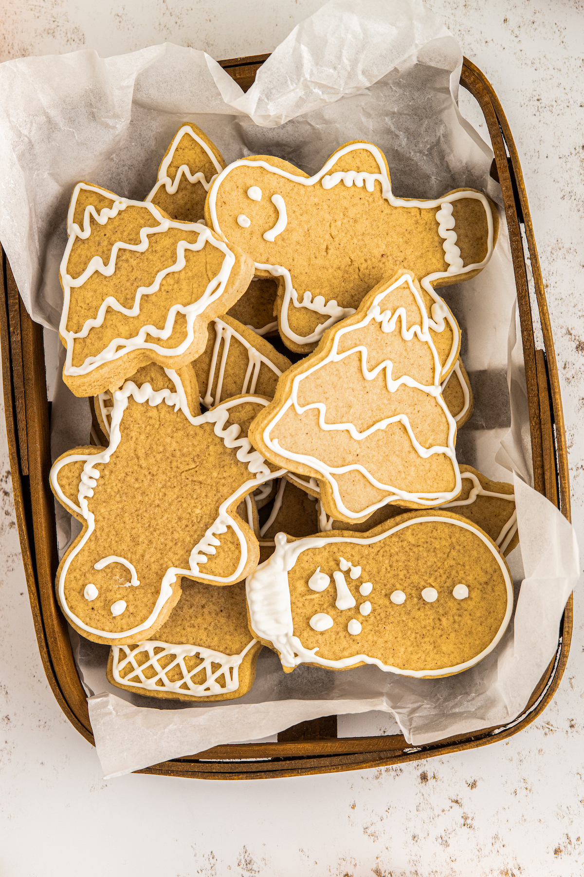 Christmas cut-out sugar cookies in a wax-paper lined basket.
