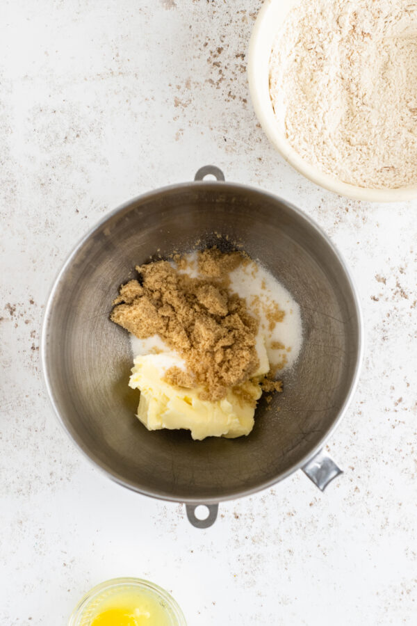 Butter, brown sugar, and granulated sugar in a mixing bowl.