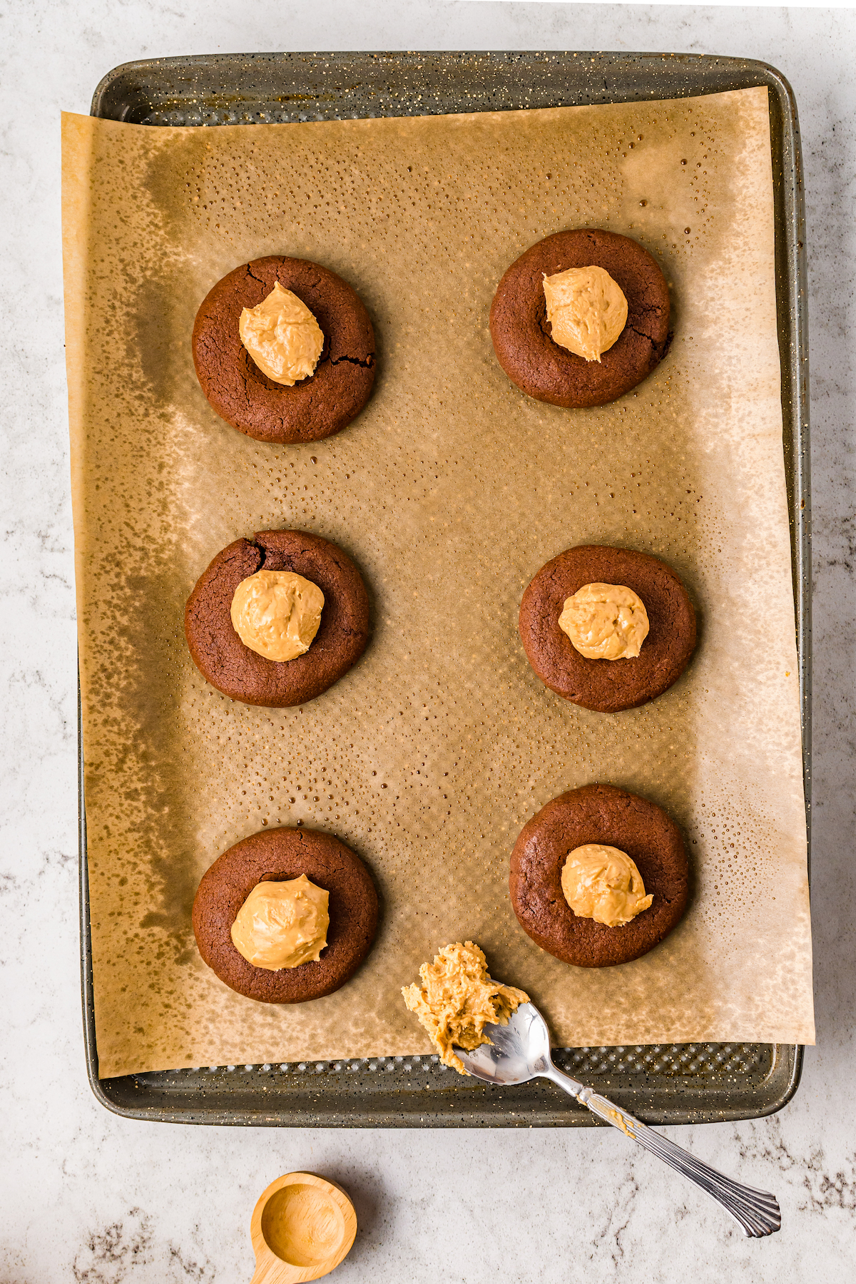 Brownie cookies topped with peanut butter balls.
