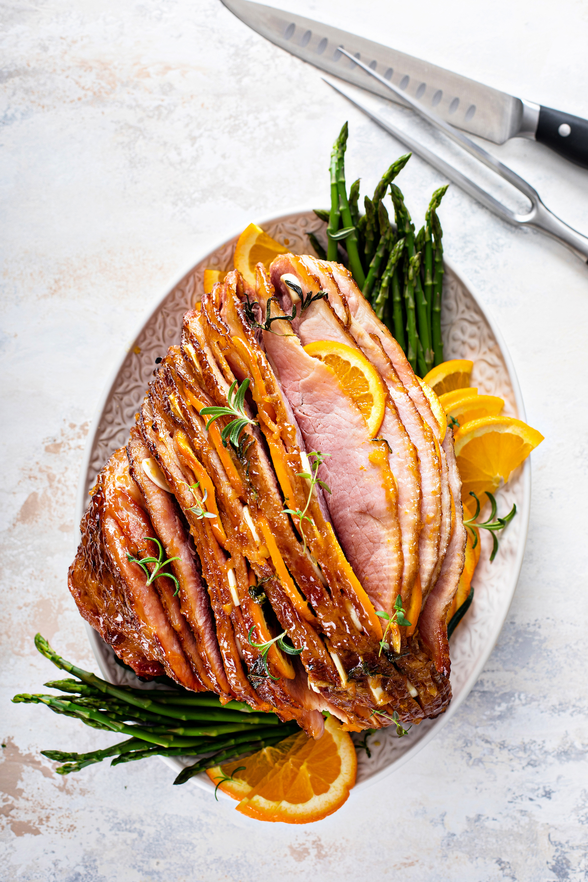 A platter of spiral-sliced glazed ham.
