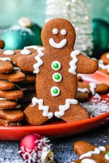 A gingerbread cookie with piped royal icing decorations.