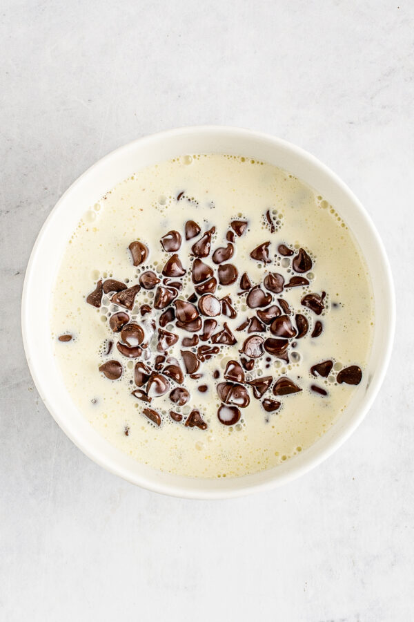Heavy cream poured over chocolate chips.
