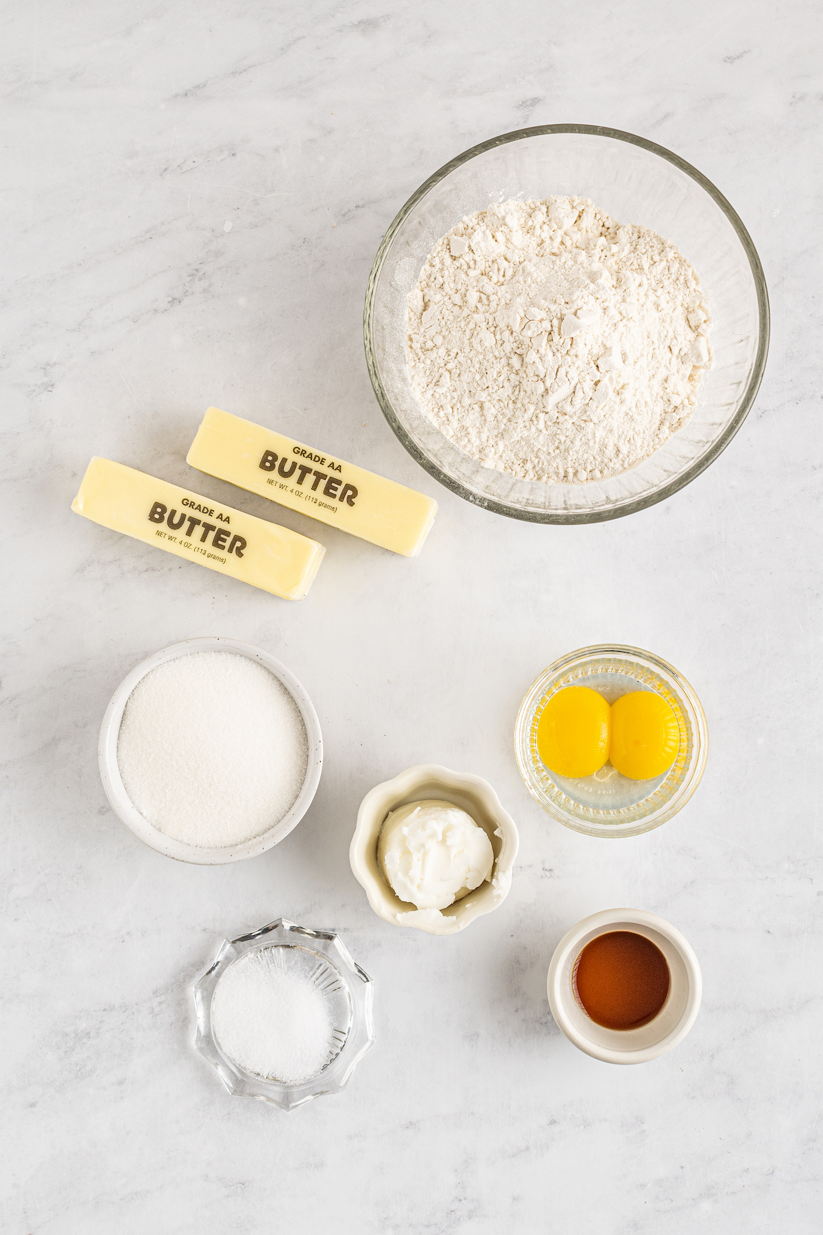 From top: flour, butter, sugar, shortening, salt, vanilla.