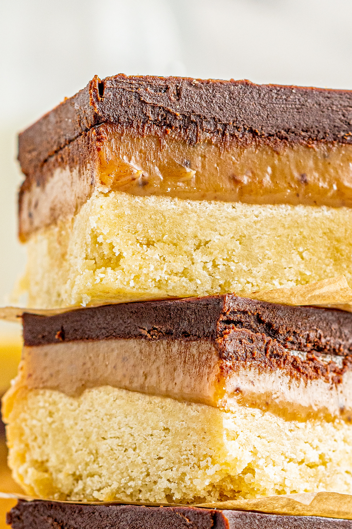 Close-up shot of millionaire shortbread from the side, showing the texture.