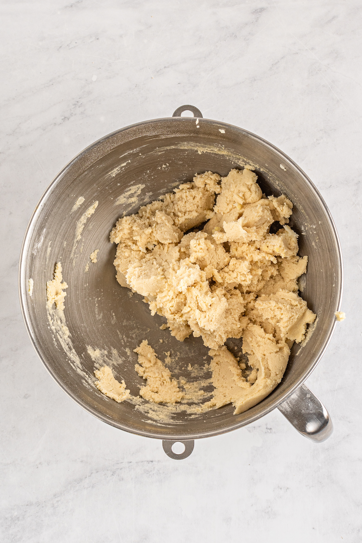 Shortbread dough in a stand mixer.