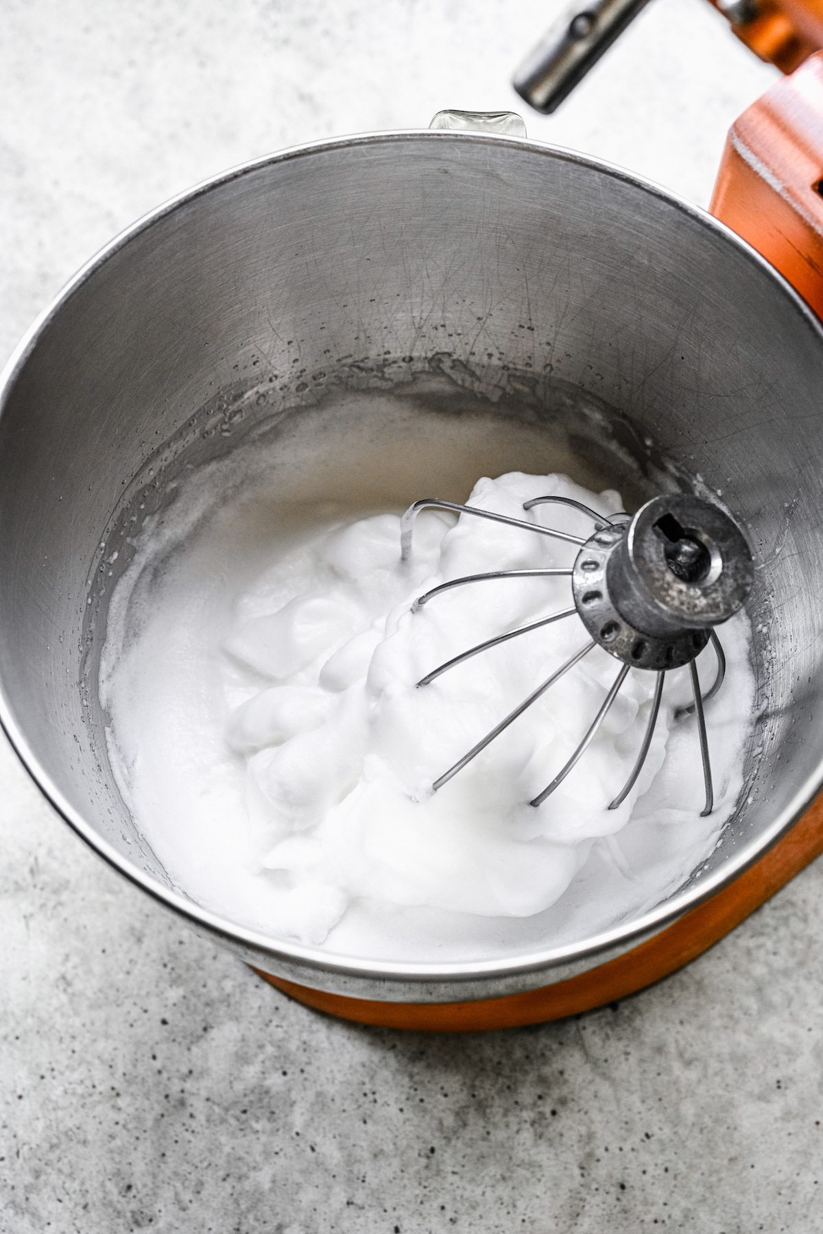 Whipping egg whites in a stand mixer.