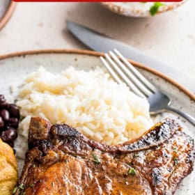 A puerto rican fried pork chop on a plate.