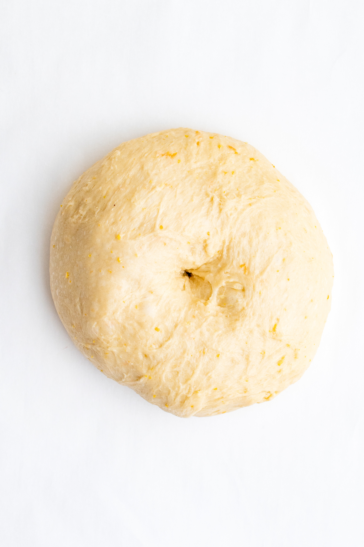 The dough with a hole poked in the center.