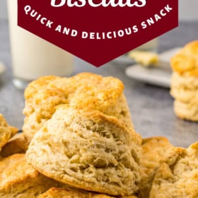 Southern biscuits stacked on top of each other in a baking pan.