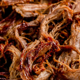 Up close image of shredded beef that has been pan fried till crispy.