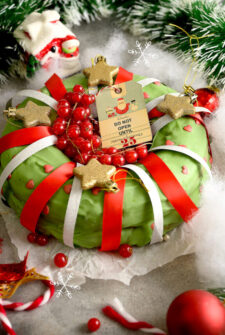 Christmas banana cake decorated with ribbons and ornaments.