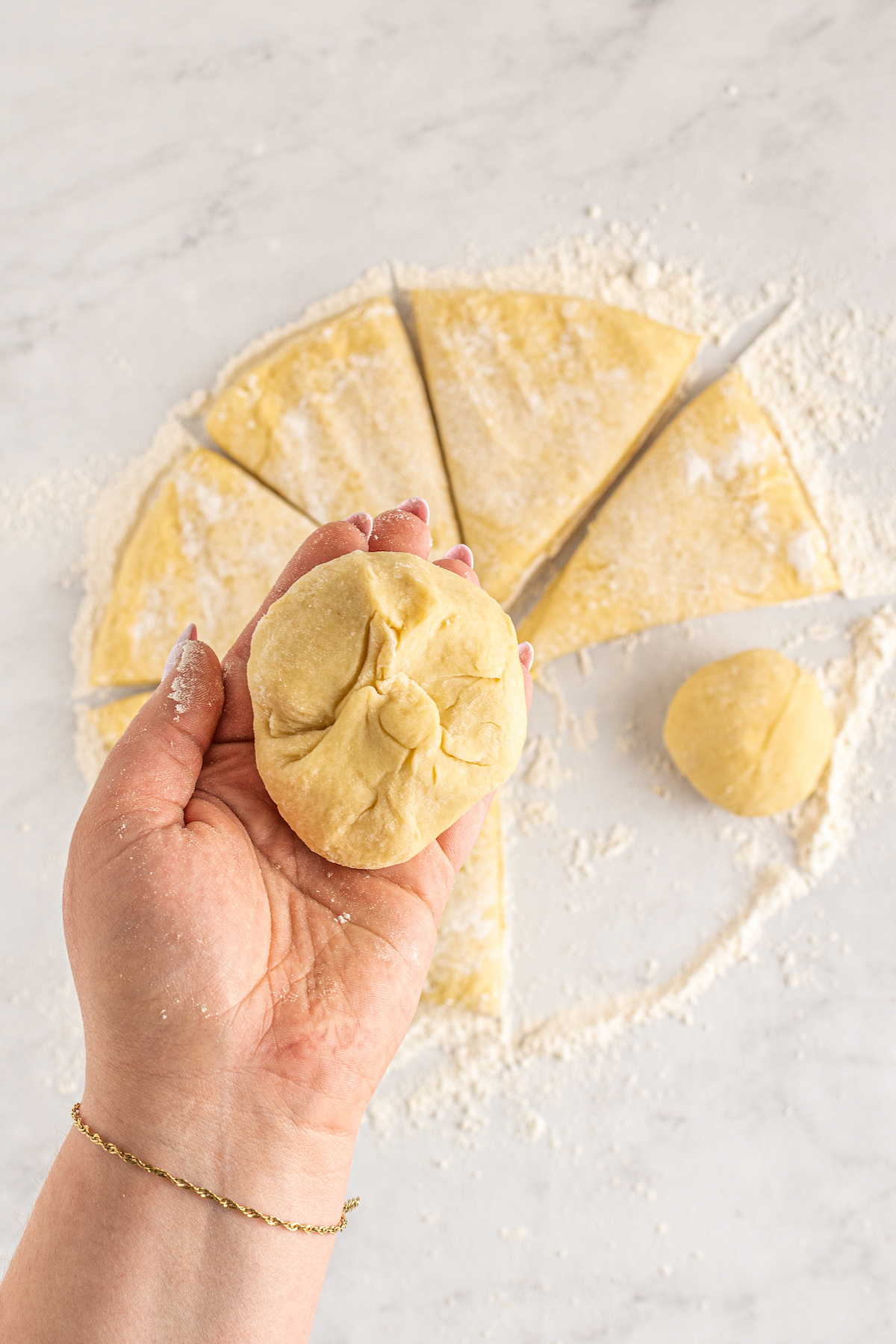 A small piece of brioche dough, shaped into a bun.