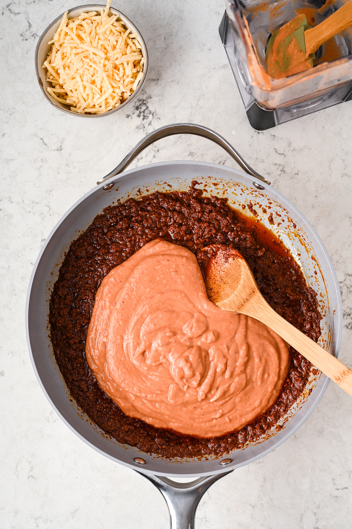 Mixing the blended beans with the chorizo.