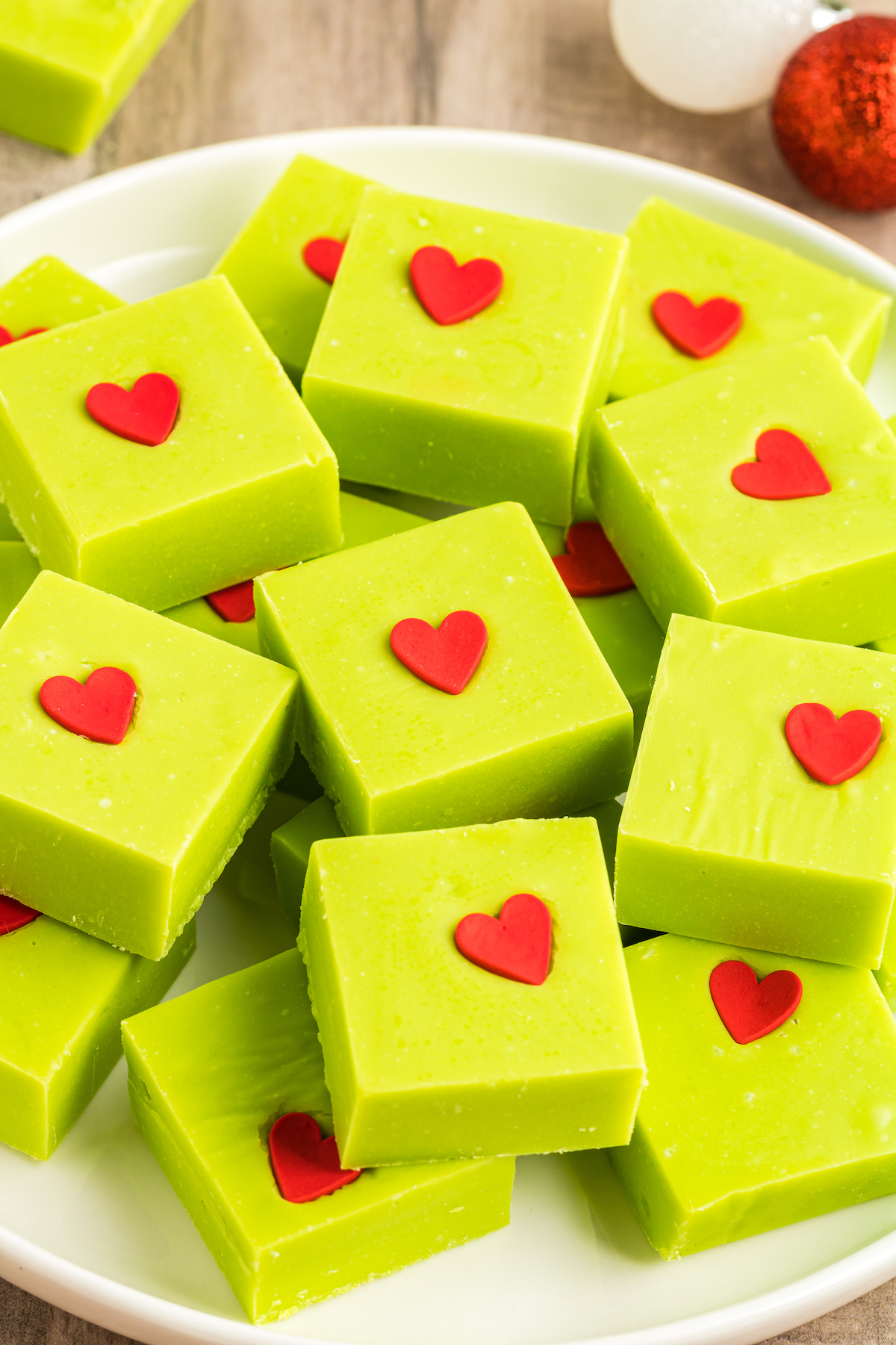 Squares of Grinch candy with red hearts.