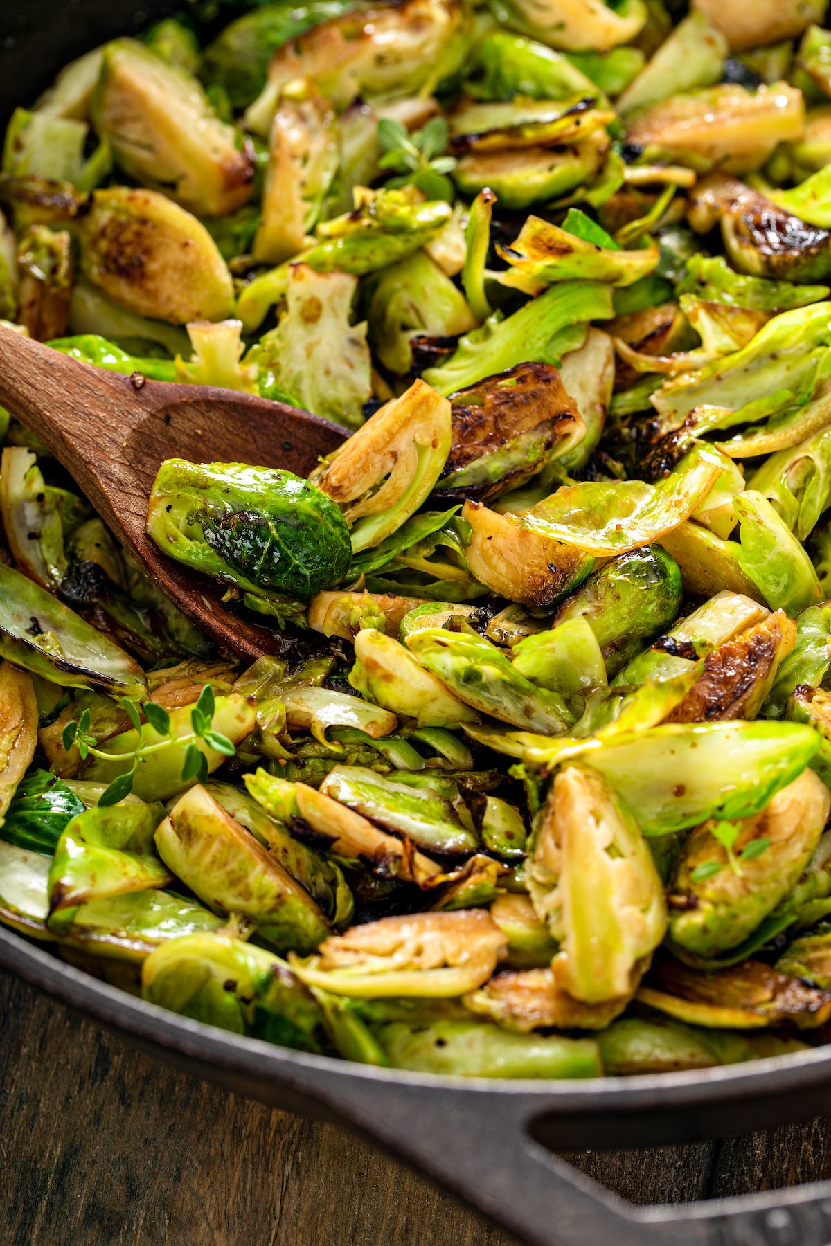 Close-up shot of brussels sprouts in a cast-iron pan.