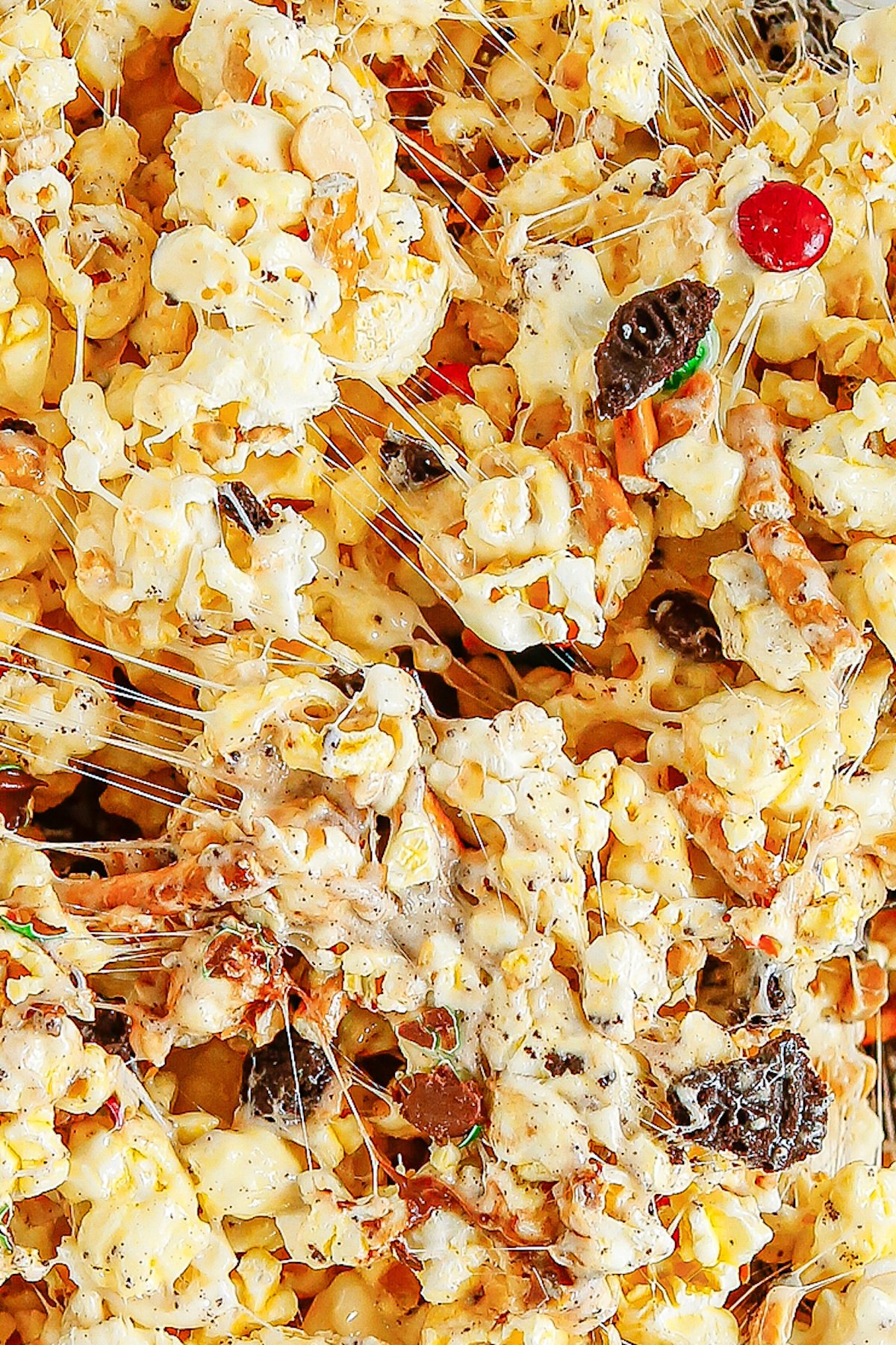 Close-up shot of popcorn coated in melted marshmallow sauce.