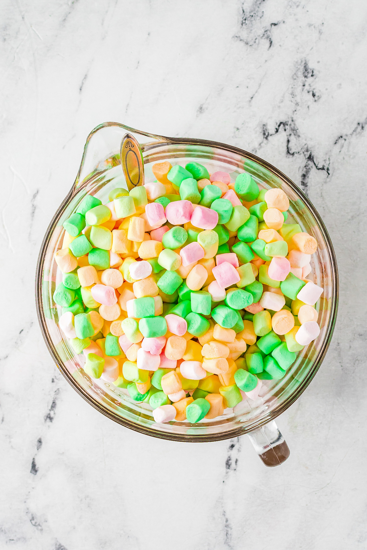 Colored marshmallows in a mixing bowl.