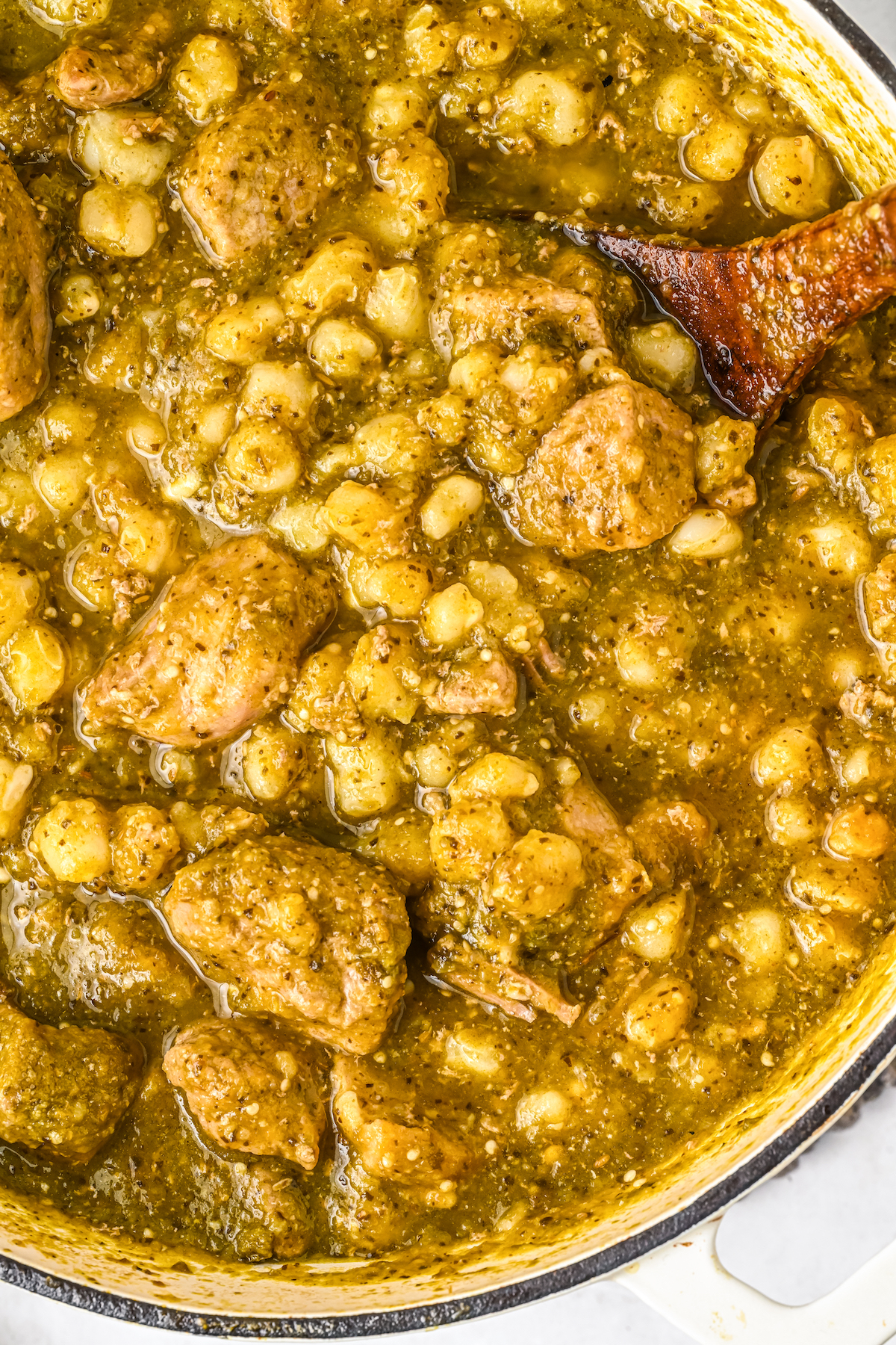 Close-up of pork pozole verde in a pot.