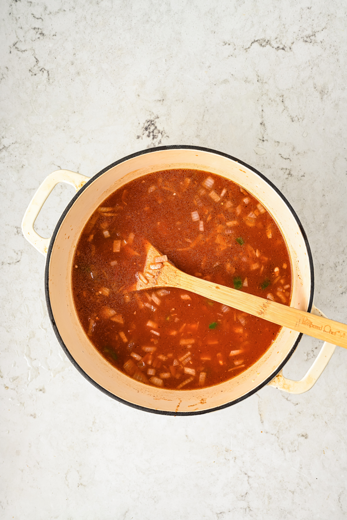 Adding the beans and water to the pot. 