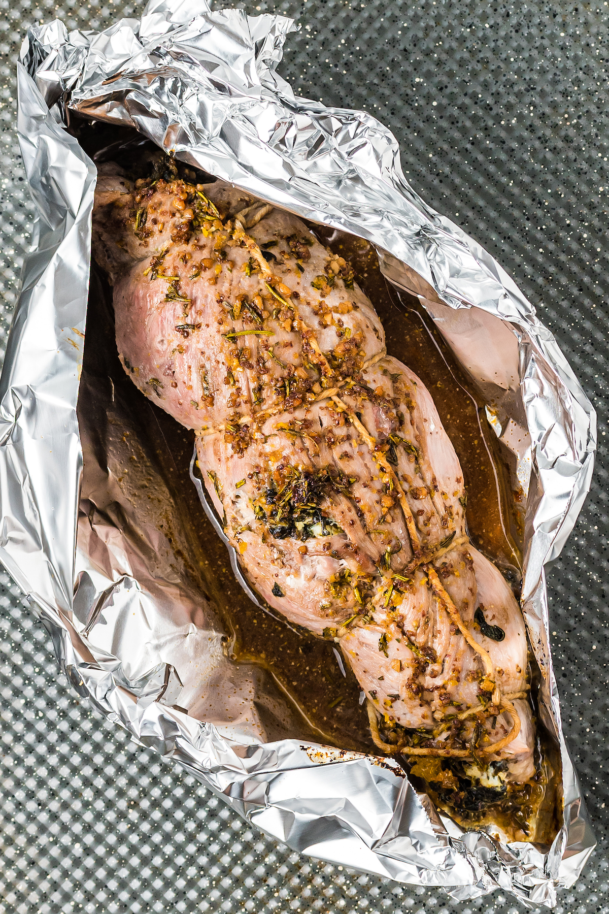 Baked stuffed pork loin in foil.