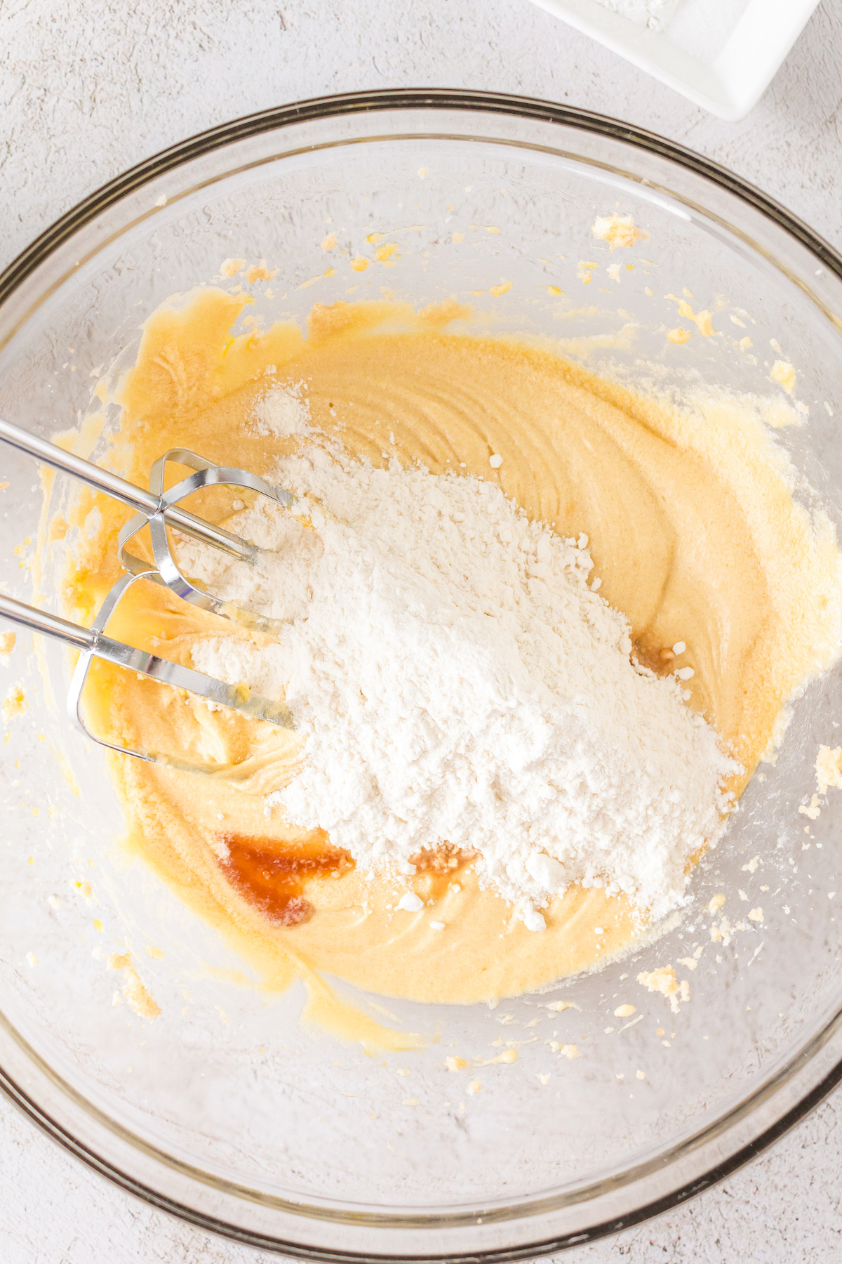 Incorporating the dry ingredients into the batter.