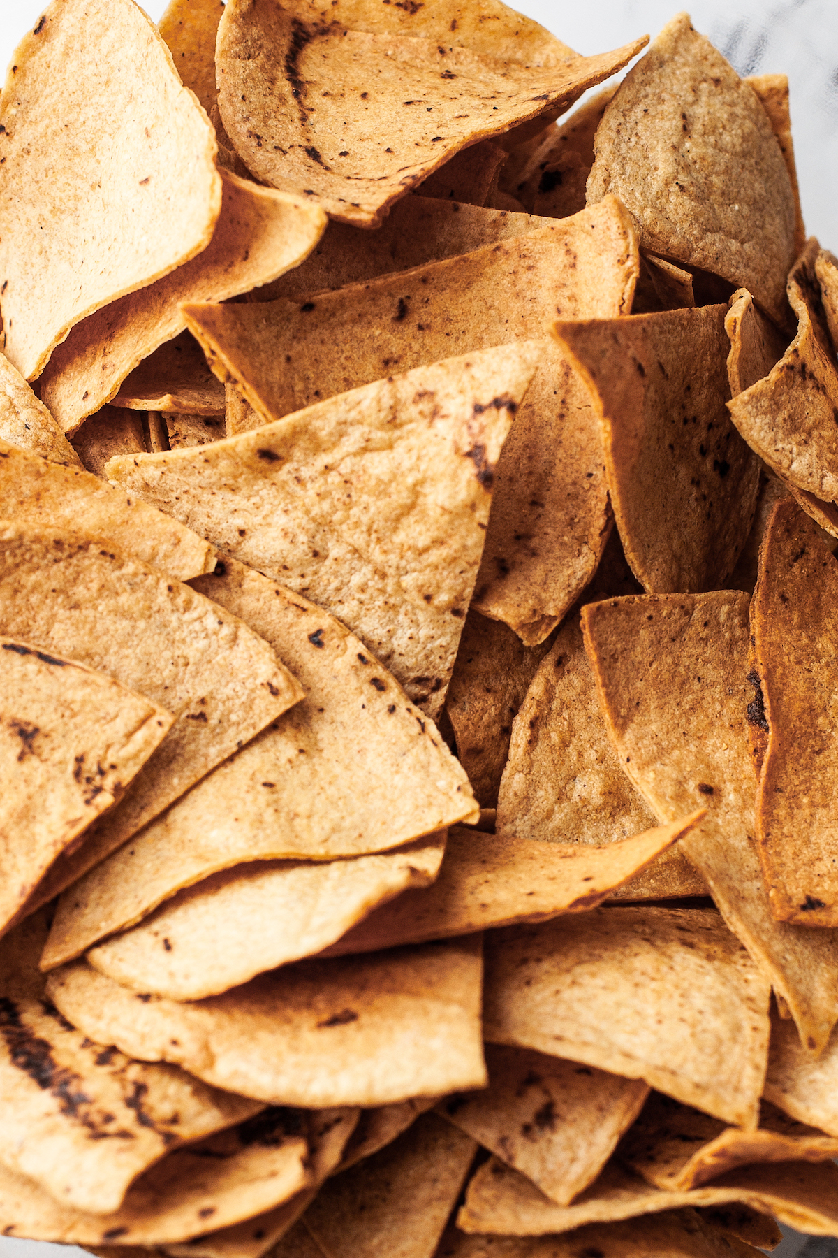 Close-up of air fryer tortilla chips.