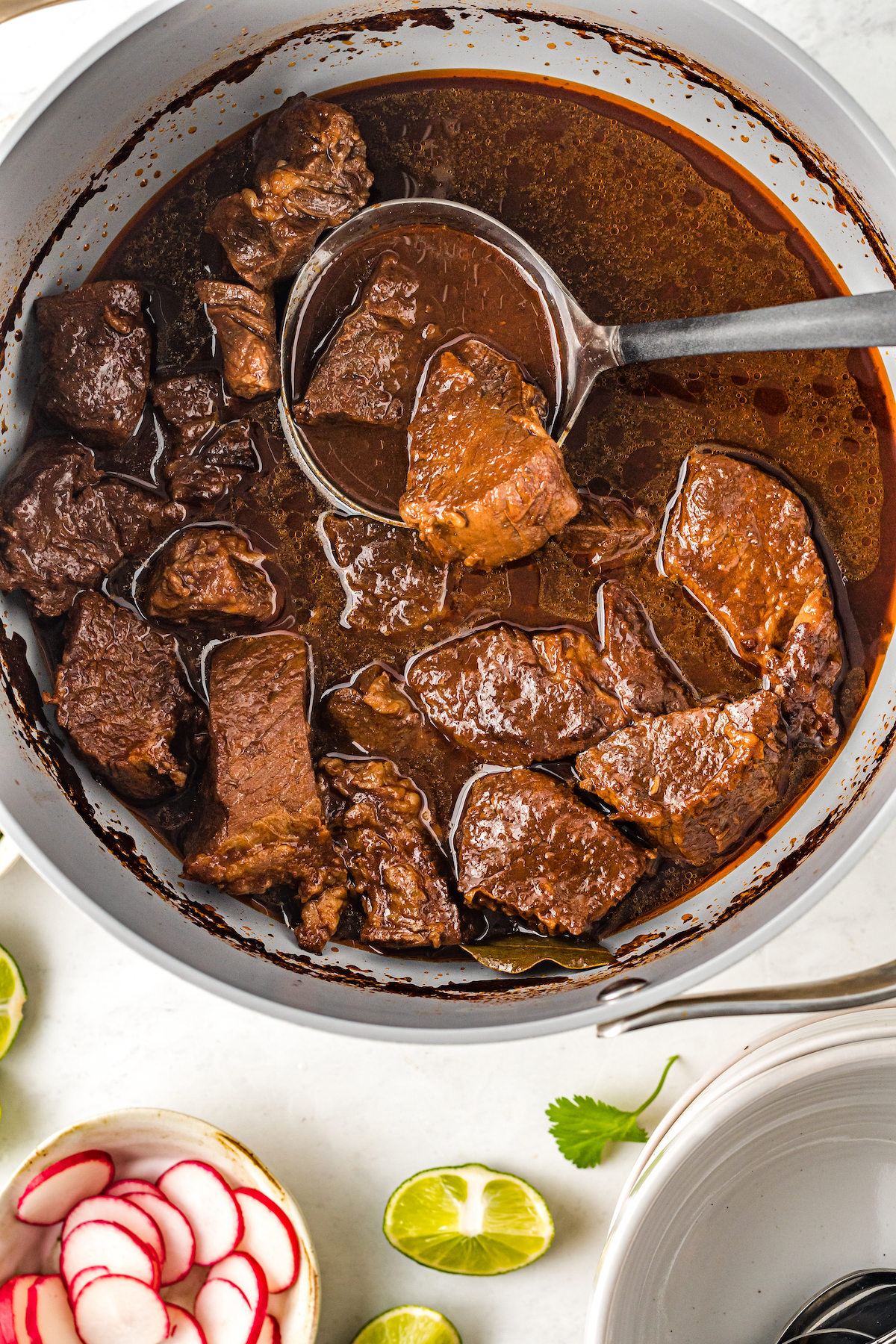 Cooked beef birria without toppings.