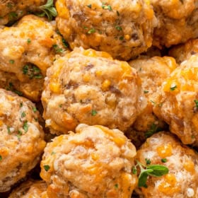 A bowl of sausage balls stacked on top of each other.