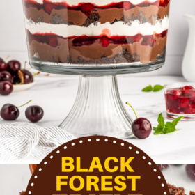 Black Forest trifle layered in a glass trifle bowl with fresh cherries on top.