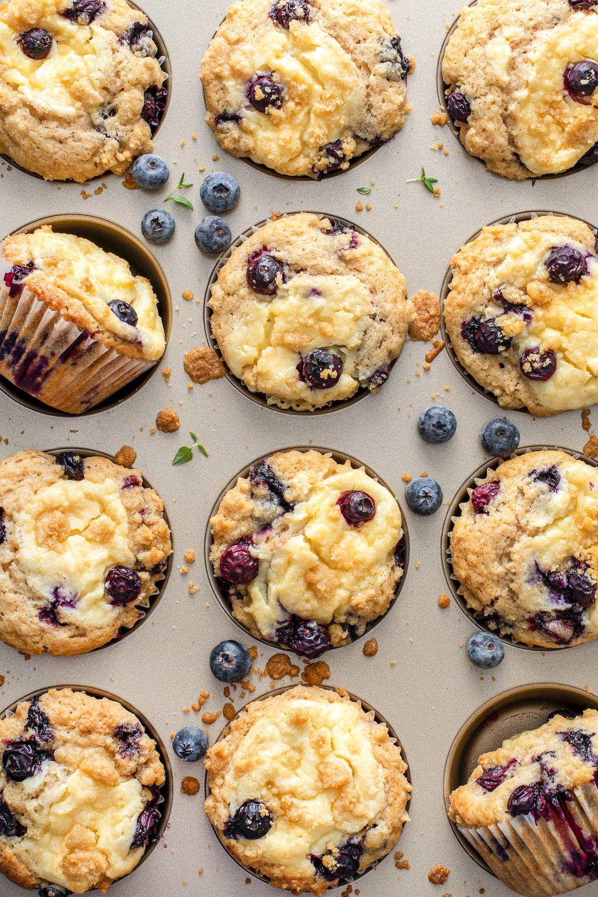 A tin of baked blueberry cream cheese muffins.