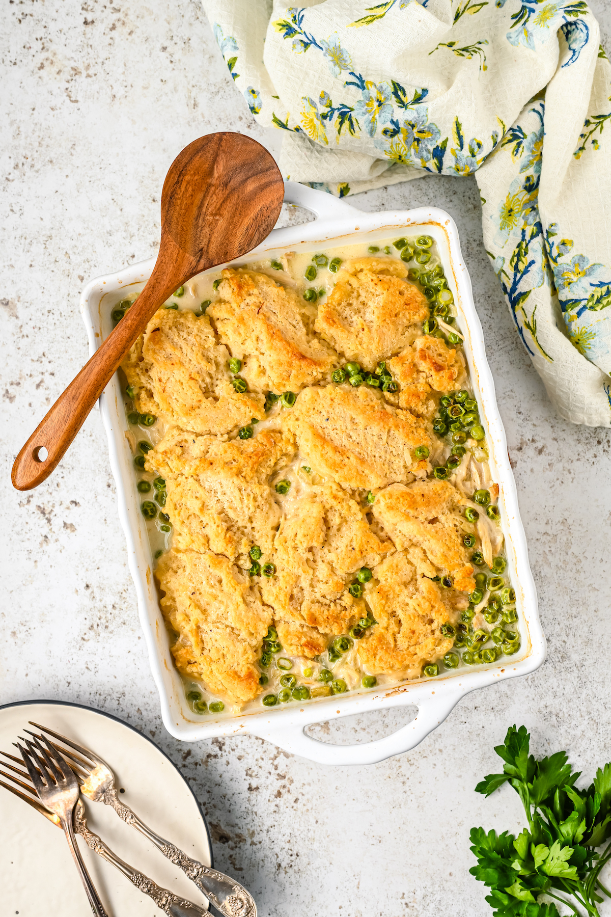 Baked chicken and dumplings casserole with peas.