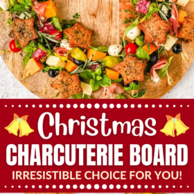 Christmas charcuterie board arranged in the shape of a wreath on a wood board.